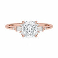 Cushion cut three-stone engagement ring, rose gold